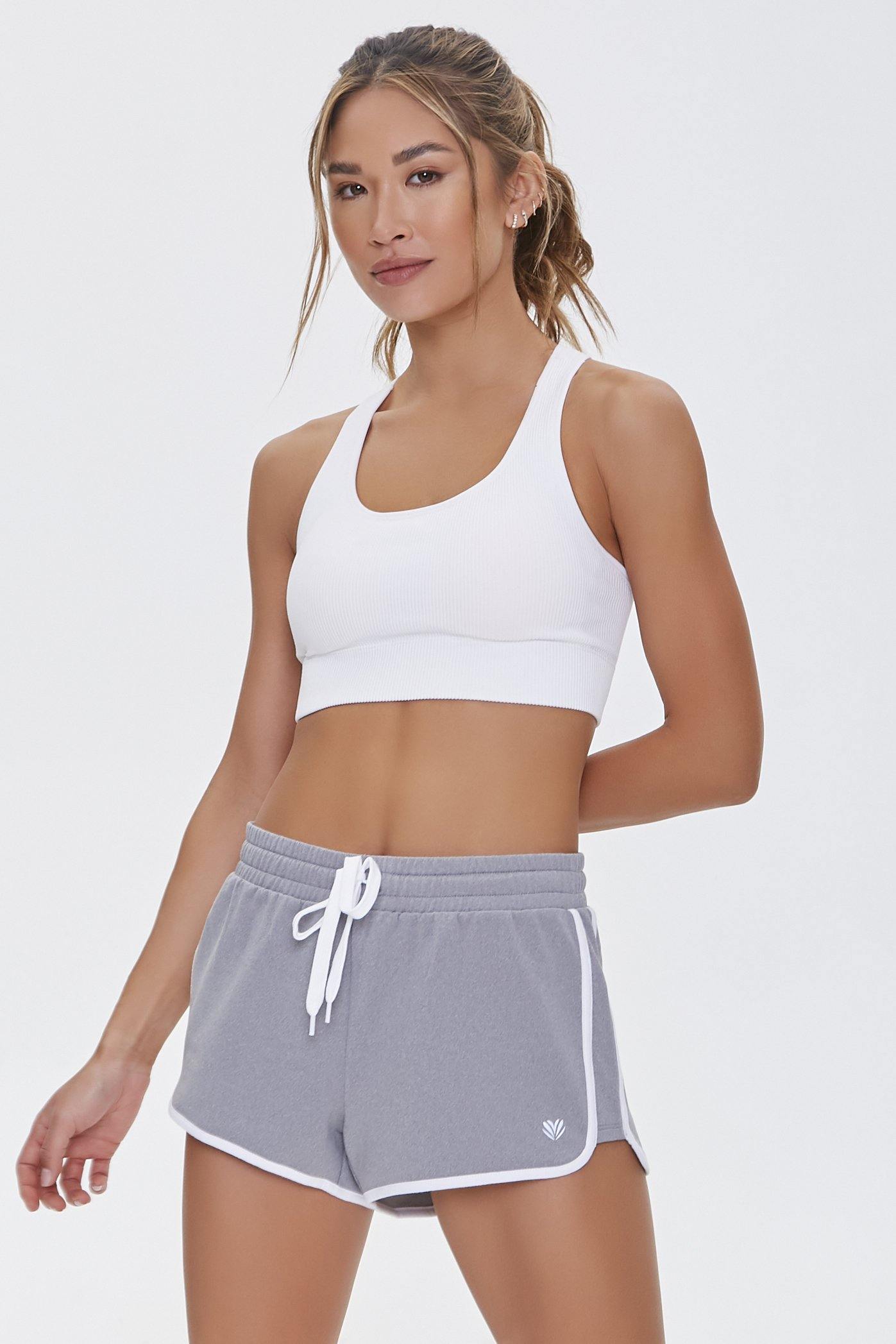 https://forever21.my/cdn/shop/products/active-contrast-trim-dolphin-shorts-forever-21-1.jpg?v=1688542555